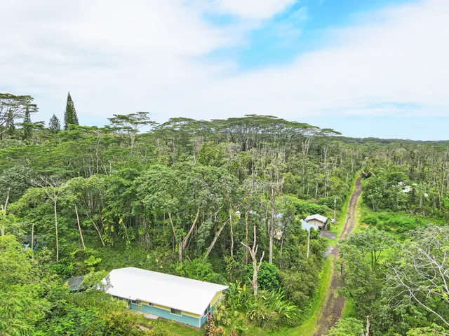 a view of a yard with an ocean view