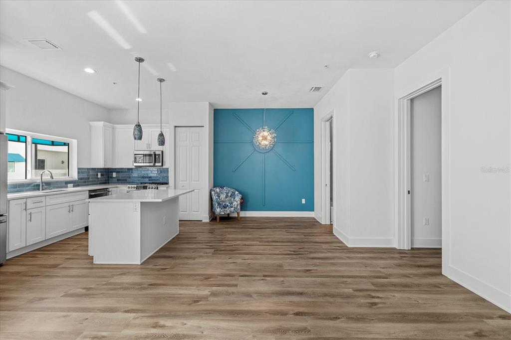 15405 Gulf Boulevard, Unit B2 Madeira Beach, FL 33708 - Photo 11 of 49 a view of kitchen with wooden floor