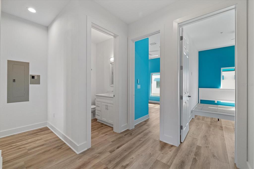 15405 Gulf Boulevard, Unit B2 Madeira Beach, FL 33708 - Photo 18 of 49 wooden floor with white walls