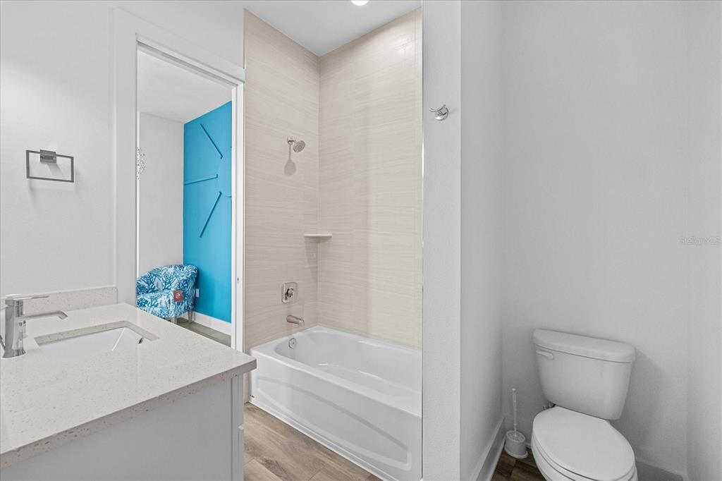 15405 Gulf Boulevard, Unit B2 Madeira Beach, FL 33708 - Photo 21 of 49 a bathroom with a sink toilet and bathtub