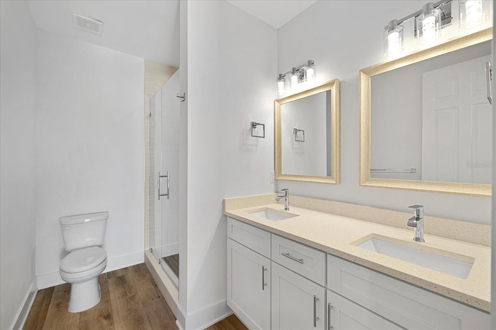 15405 Gulf Boulevard, Unit B2 Madeira Beach, FL 33708 - Photo 35 of 49 a bathroom with a sink and a mirror