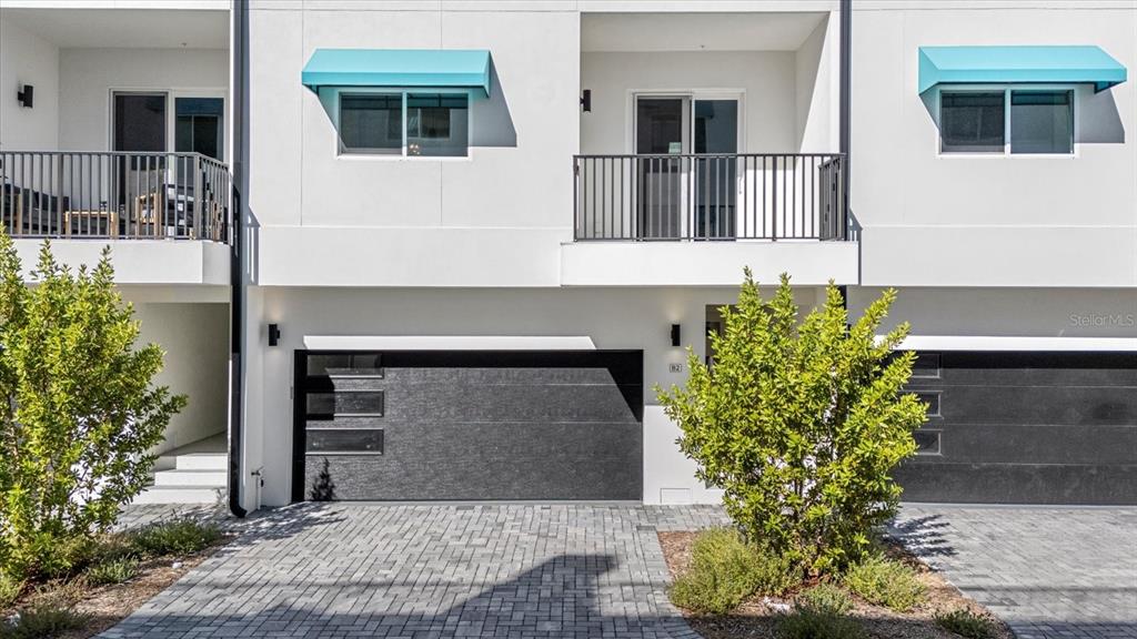 15405 Gulf Boulevard, Unit B2 Madeira Beach, FL 33708 - Photo 39 of 49 a front view of a house with garden
