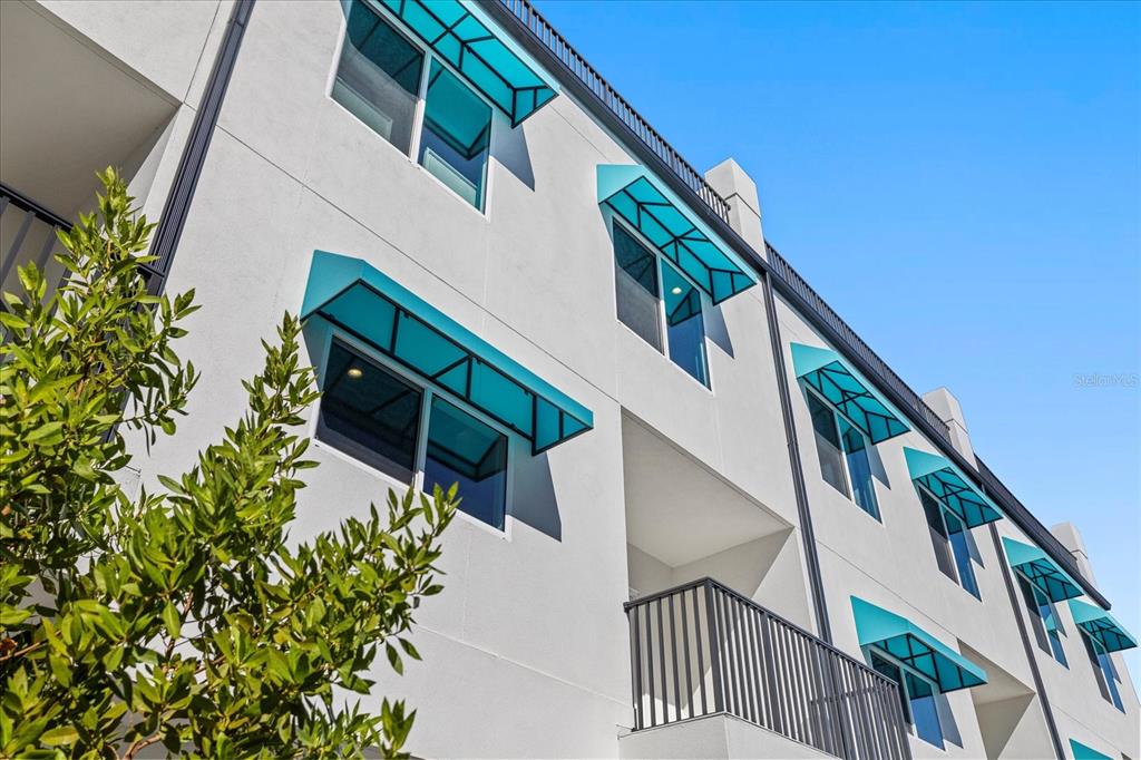 15405 Gulf Boulevard, Unit B2 Madeira Beach, FL 33708 - Photo 43 of 49 a house with flower in front of it