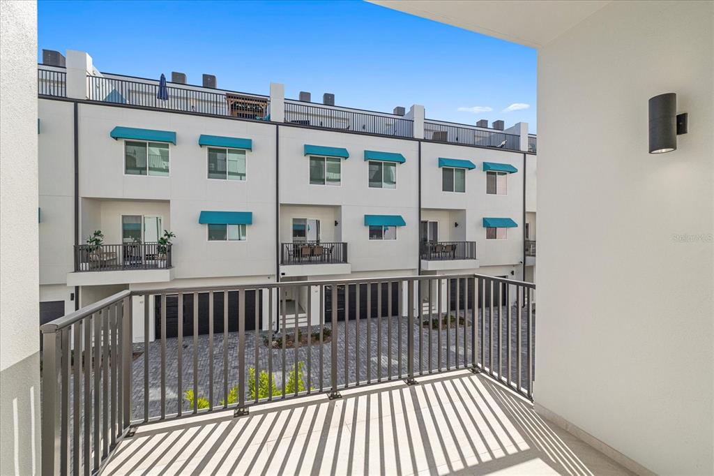 15405 Gulf Boulevard, Unit B2 Madeira Beach, FL 33708 - Photo 44 of 49 a view of a brick building from a balcony
