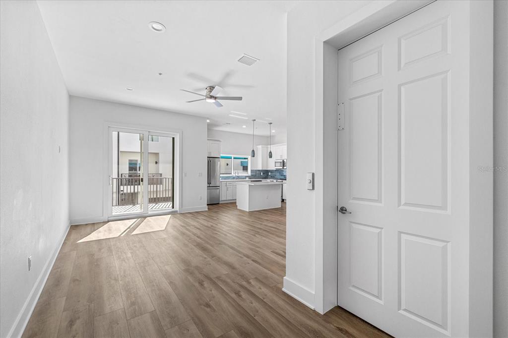 15405 Gulf Boulevard, Unit B2 Madeira Beach, FL 33708 - Photo 9 of 49 a view of a kitchen with wooden floor and a kitchen