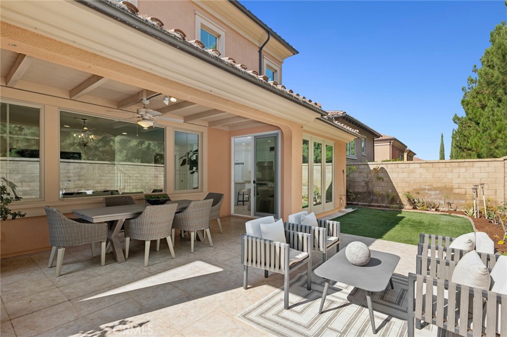 61 Lupari Irvine, CA 92618 - Photo 11 of 65 a view of a patio with a dining table and chairs with wooden floor
