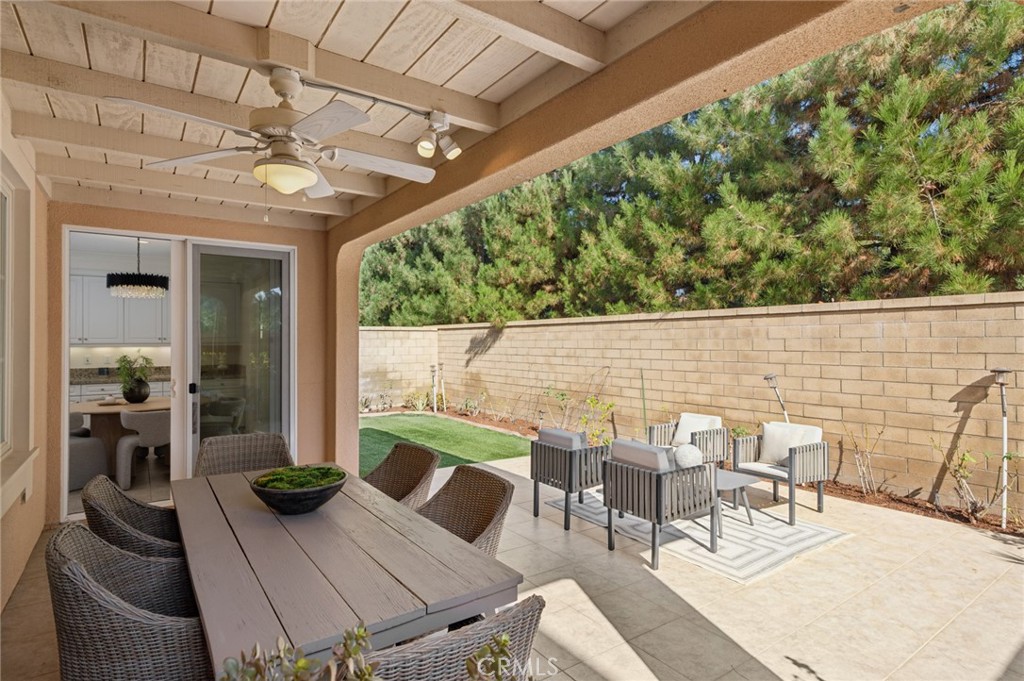 61 Lupari Irvine, CA 92618 - Photo 13 of 65 a view of a patio with table and chairs with wooden floor and plants
