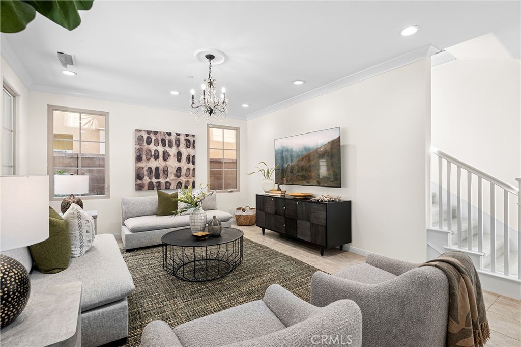 61 Lupari Irvine, CA 92618 - Photo 15 of 65 a living room with furniture and a flat screen tv