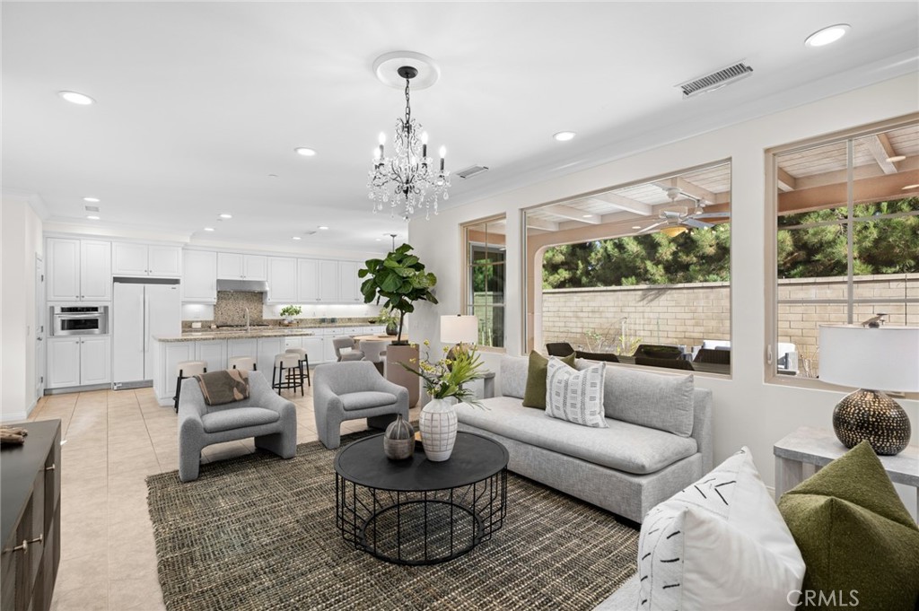 61 Lupari Irvine, CA 92618 - Photo 2 of 65 a living room with furniture and a chandelier