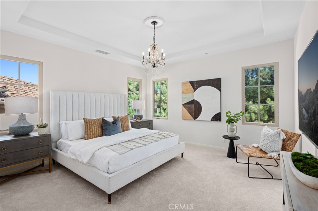 61 Lupari Irvine, CA 92618 - Photo 22 of 65 a bedroom with bed and a window