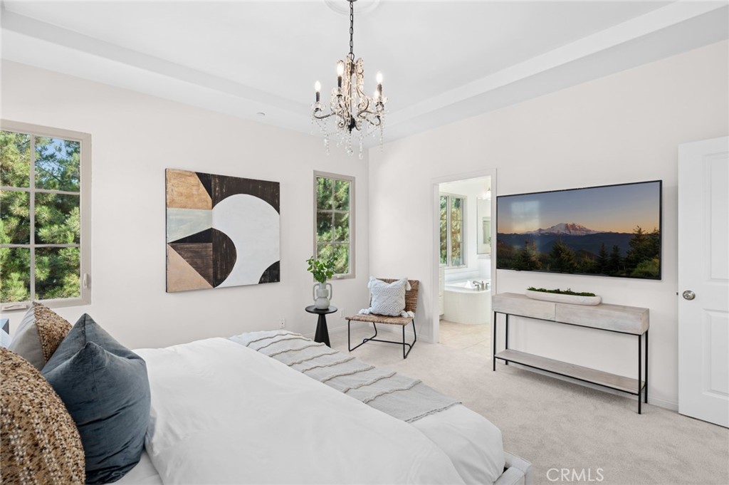 61 Lupari Irvine, CA 92618 - Photo 23 of 65 a living room with furniture and a flat screen tv