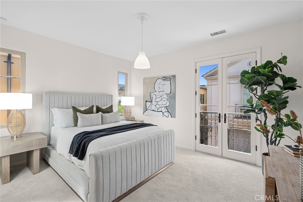 61 Lupari Irvine, CA 92618 - Photo 26 of 65 a bedroom with a bed and a potted plant