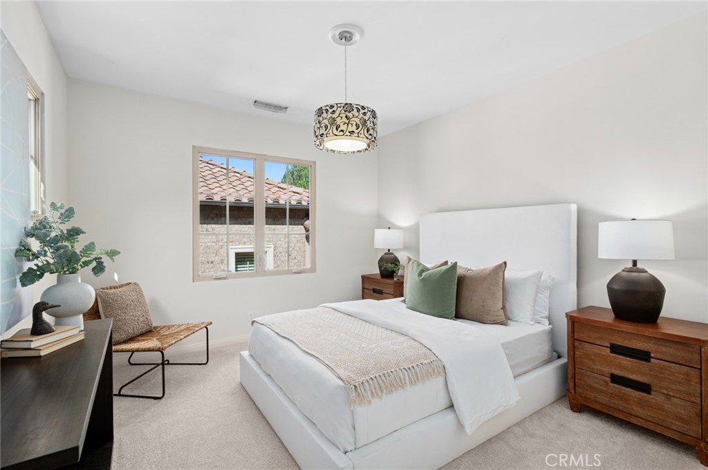 61 Lupari Irvine, CA 92618 - Photo 28 of 65 a bedroom with a bed and a window