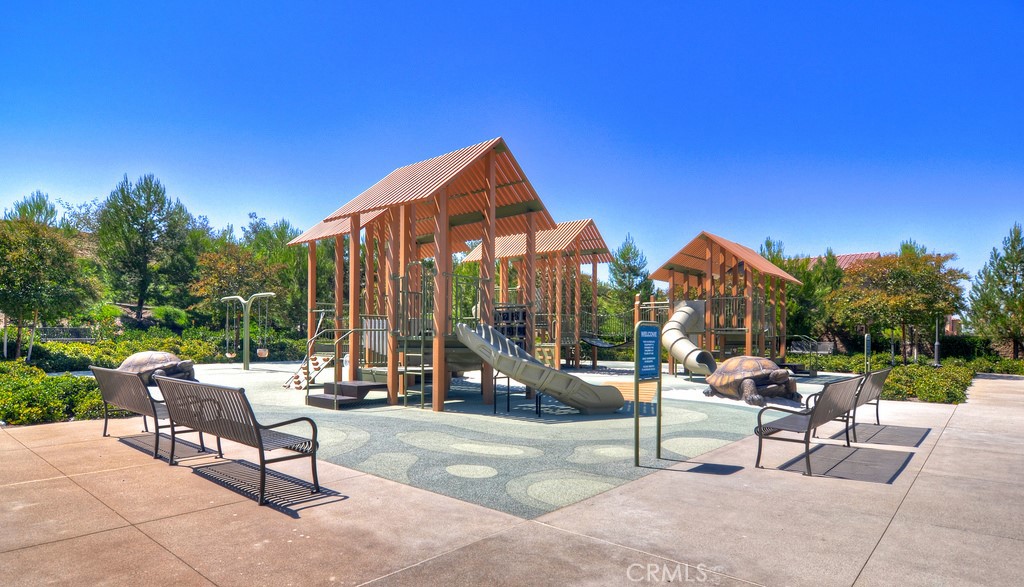 61 Lupari Irvine, CA 92618 - Photo 35 of 65 a view of a patio with a table and chairs