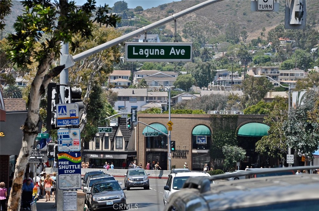 61 Lupari Irvine, CA 92618 - Photo 58 of 65 a group of cars parked in front of retail shop