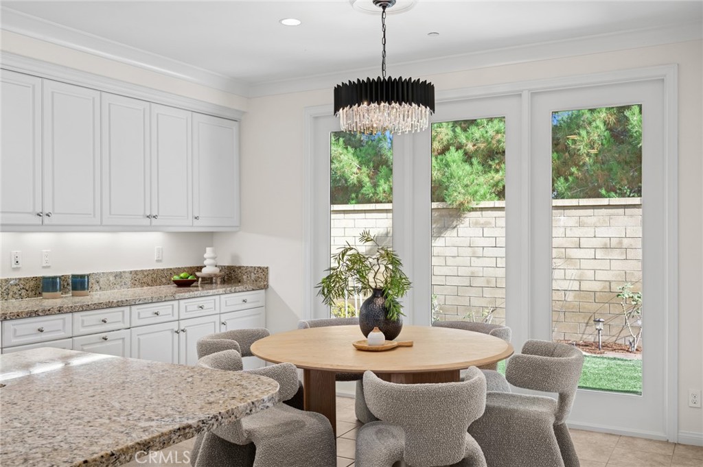 61 Lupari Irvine, CA 92618 - Photo 7 of 65 a kitchen with a table and chairs