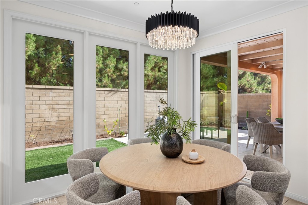 61 Lupari Irvine, CA 92618 - Photo 9 of 65 a view of a dining room with furniture window and outside view