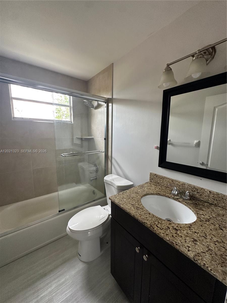 354 Mallard Road, Unit O Weston, FL 33327 - Photo 15 of 29 a bathroom with a granite countertop sink toilet and shower