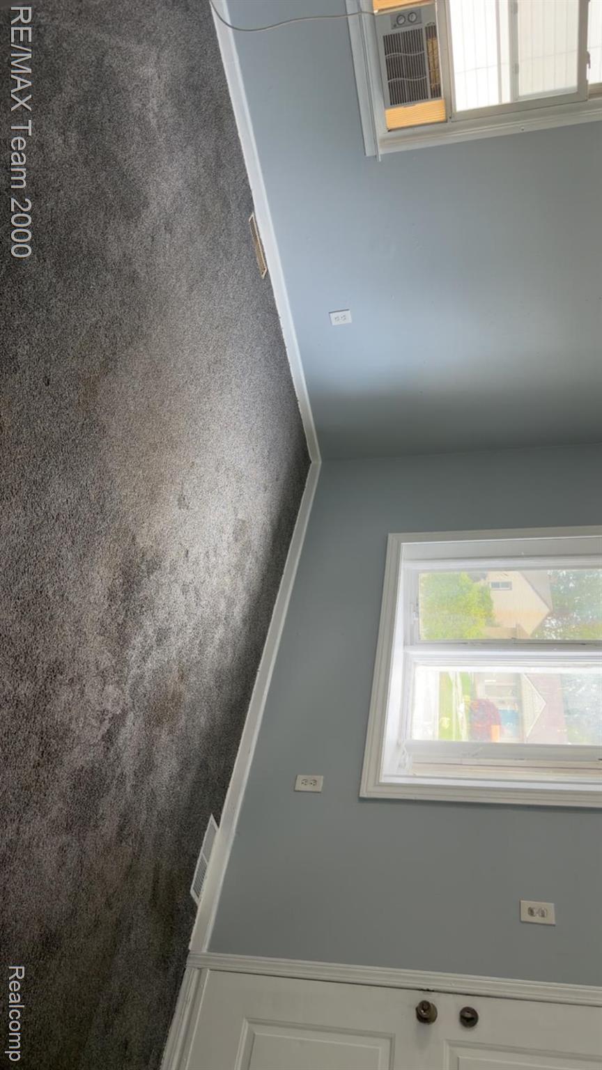 6646 Harding Street Taylor, MI 48180 - Photo 3 of 12 Carpeted room with light blue walls and white trim