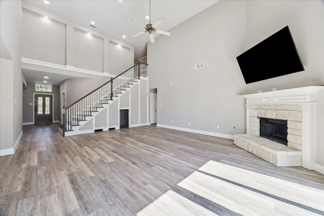 a view of a livingroom with an empty space and a fireplace