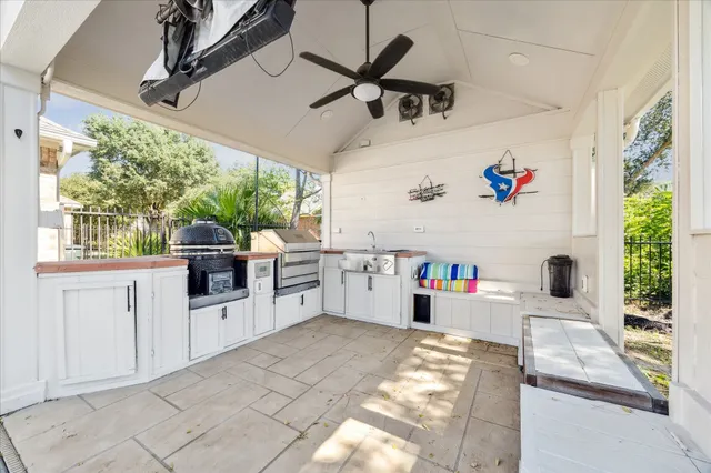 a kitchen with stainless steel appliances a stove a refrigerator and cabinets