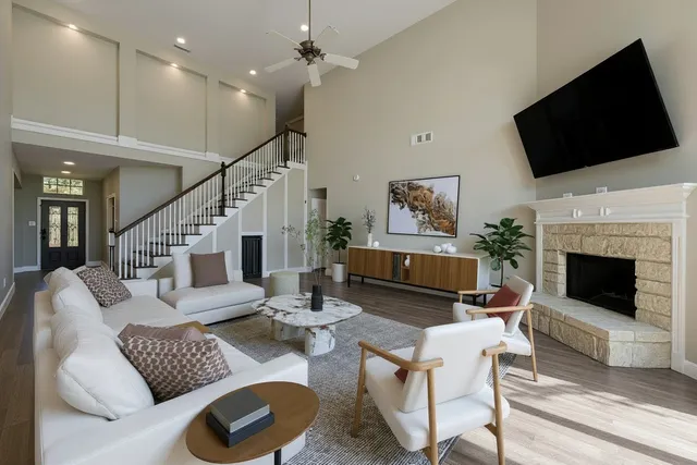 a living room with furniture fireplace and a flat screen tv