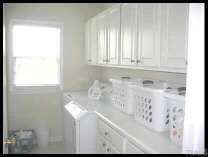 7616 Silver View Lane Raleigh, NC 27613 - Photo 7 of 10 a bathroom with a sink and a mirror