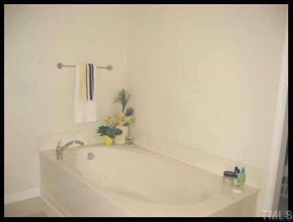7616 Silver View Lane Raleigh, NC 27613 - Photo 10 of 10 a bathroom with a bathtub