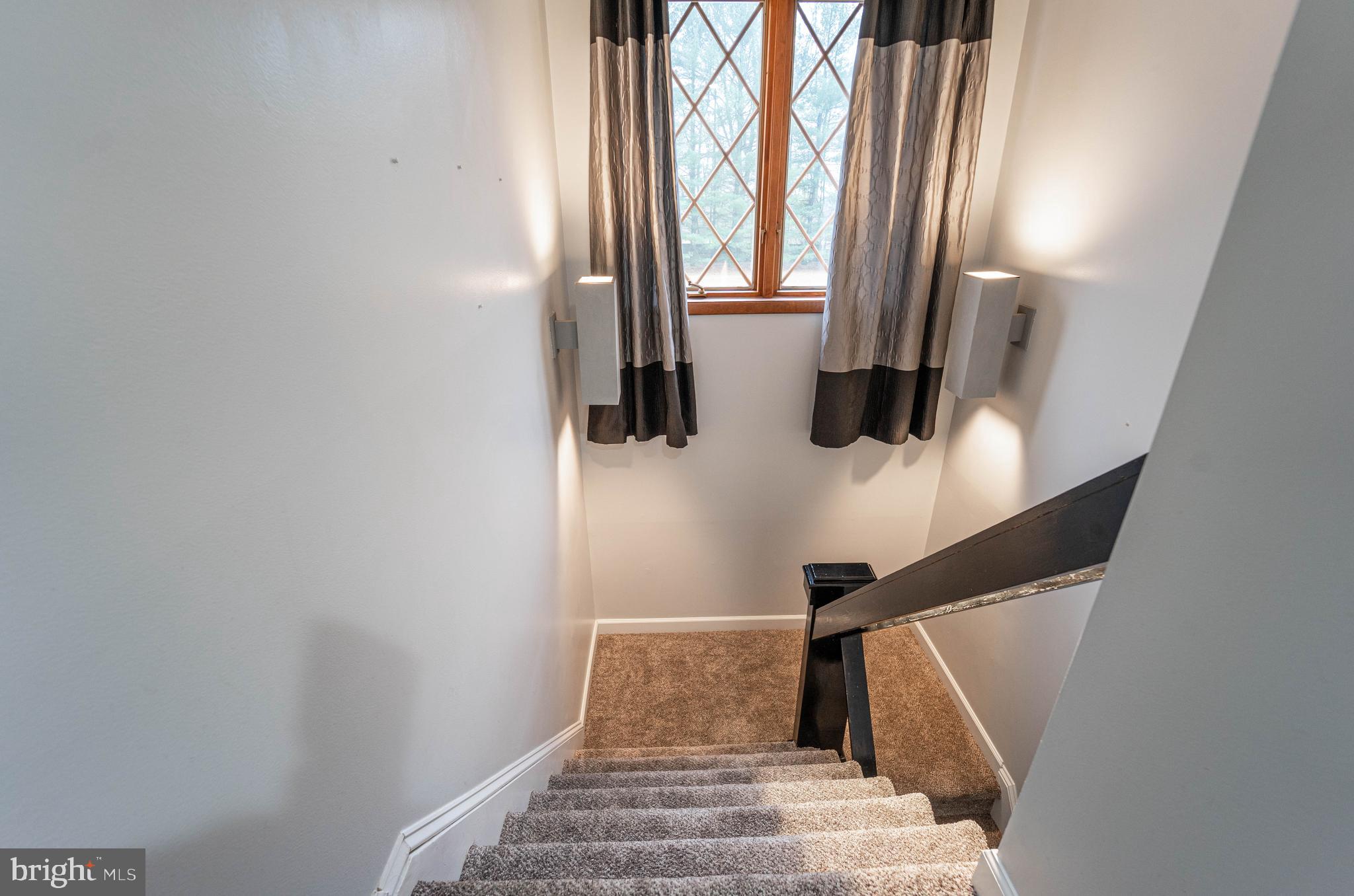 327 Crowl Road Westminster, MD 21158 - Photo 40 of 75 Custom-lit stairs leading to the upper landing