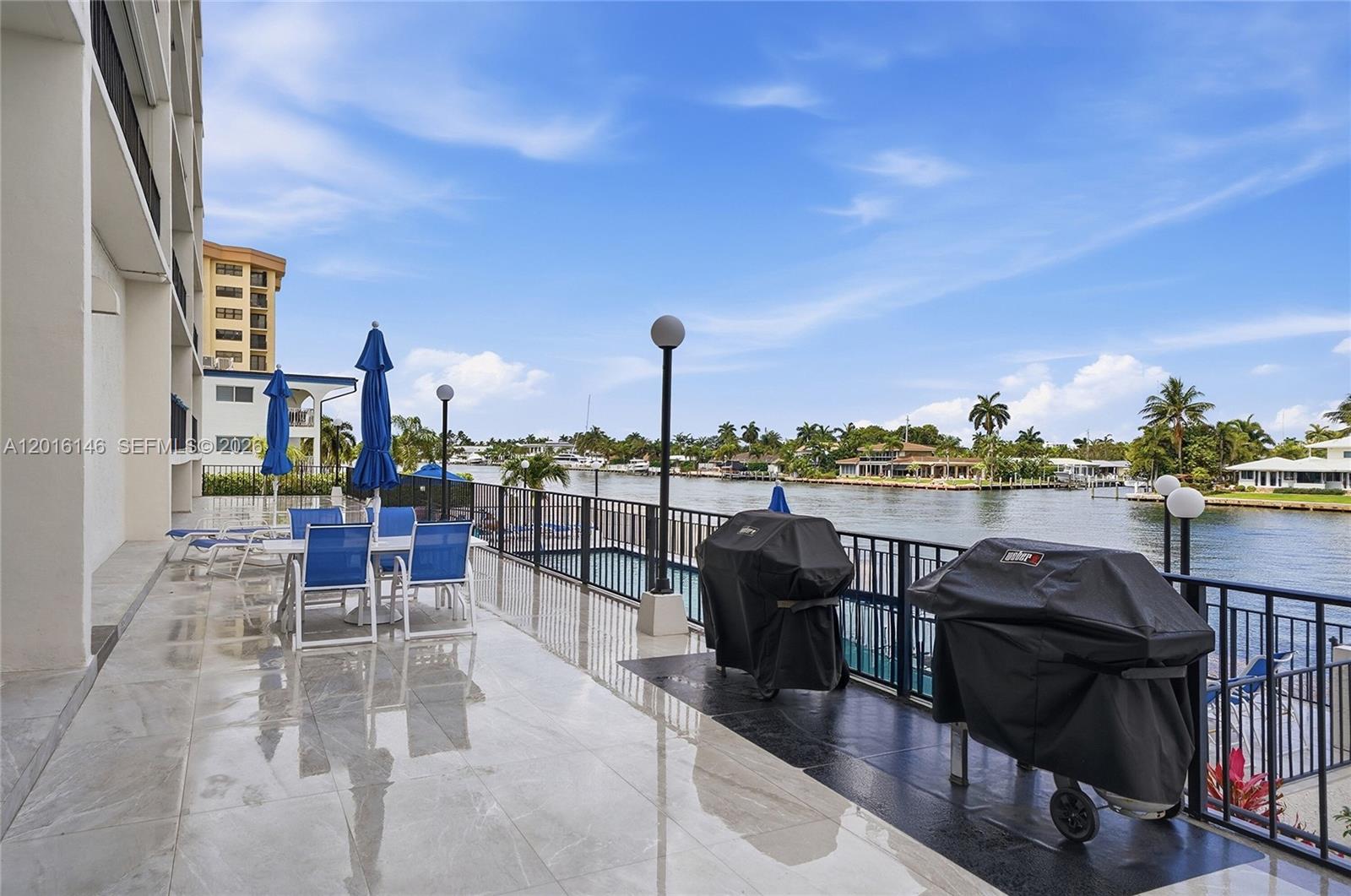 521 North Riverside Drive, Unit 606 Pompano Beach, FL 33062 - Photo 33 of 50 a view of a balcony with chairs