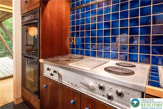 a kitchen with a stove and a microwave
