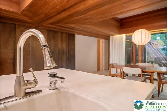 a room with a large bed and a chandelier