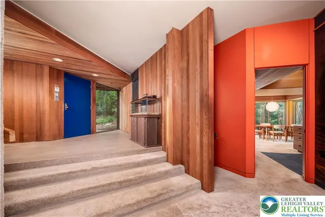 a view of a closet area with an entryway