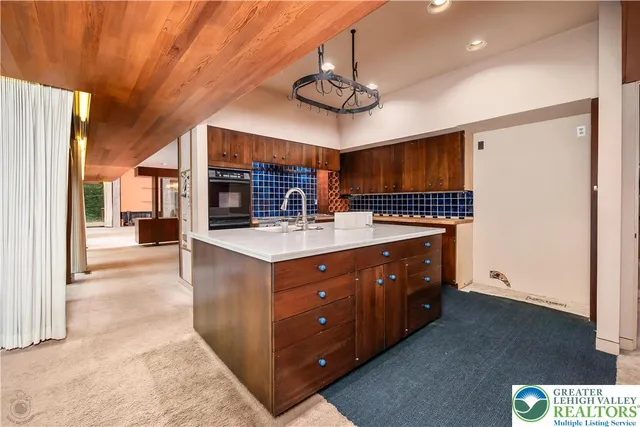 a bathroom with a sink a large mirror and a shower