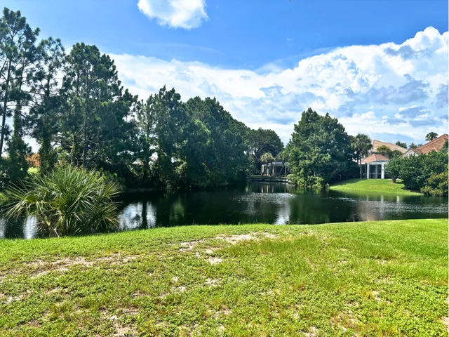 a view of lake with a big yard