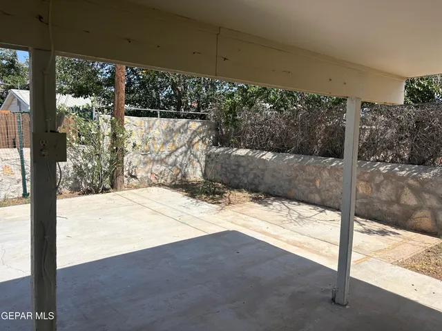 a view of a backyard of the house