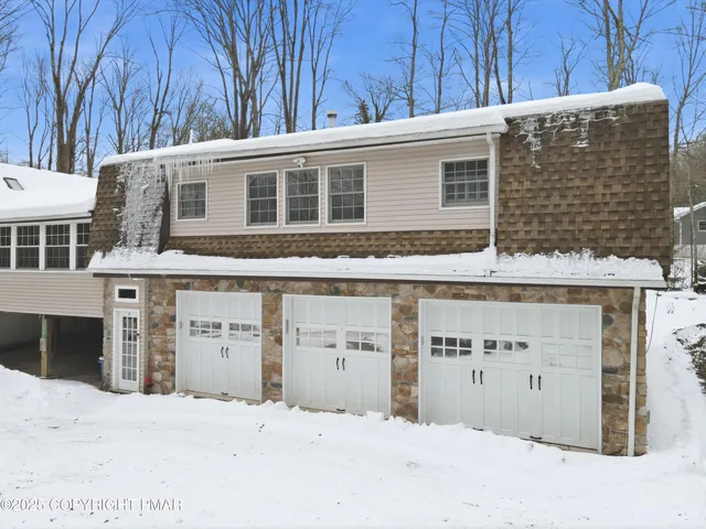 a kitchen with refrigerator cabinets and wooden floor
