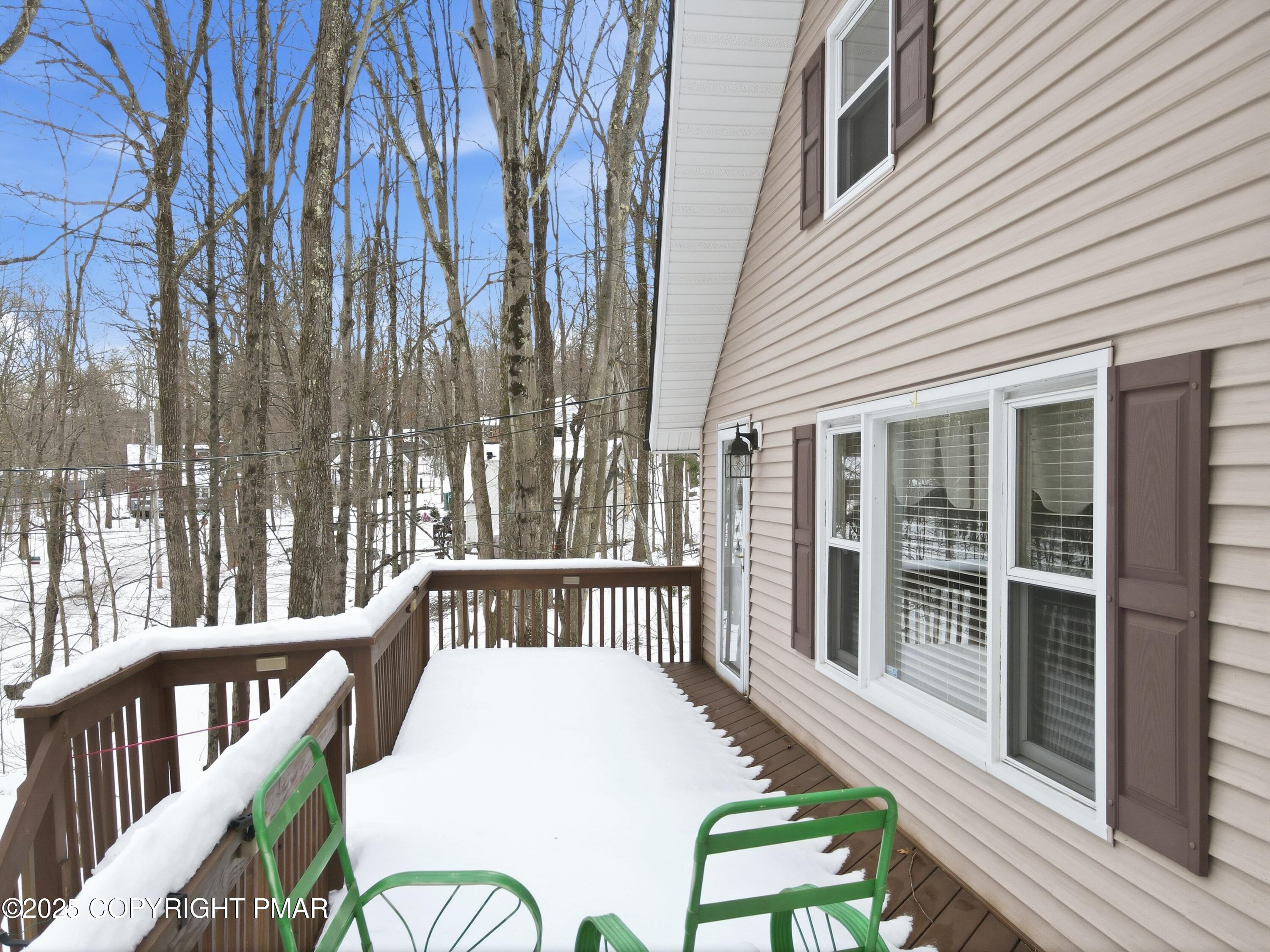 178 Comanche Trail Pocono Lake, PA 18347 - Photo 121 of 138 a view of a chair and tables in the balcony
