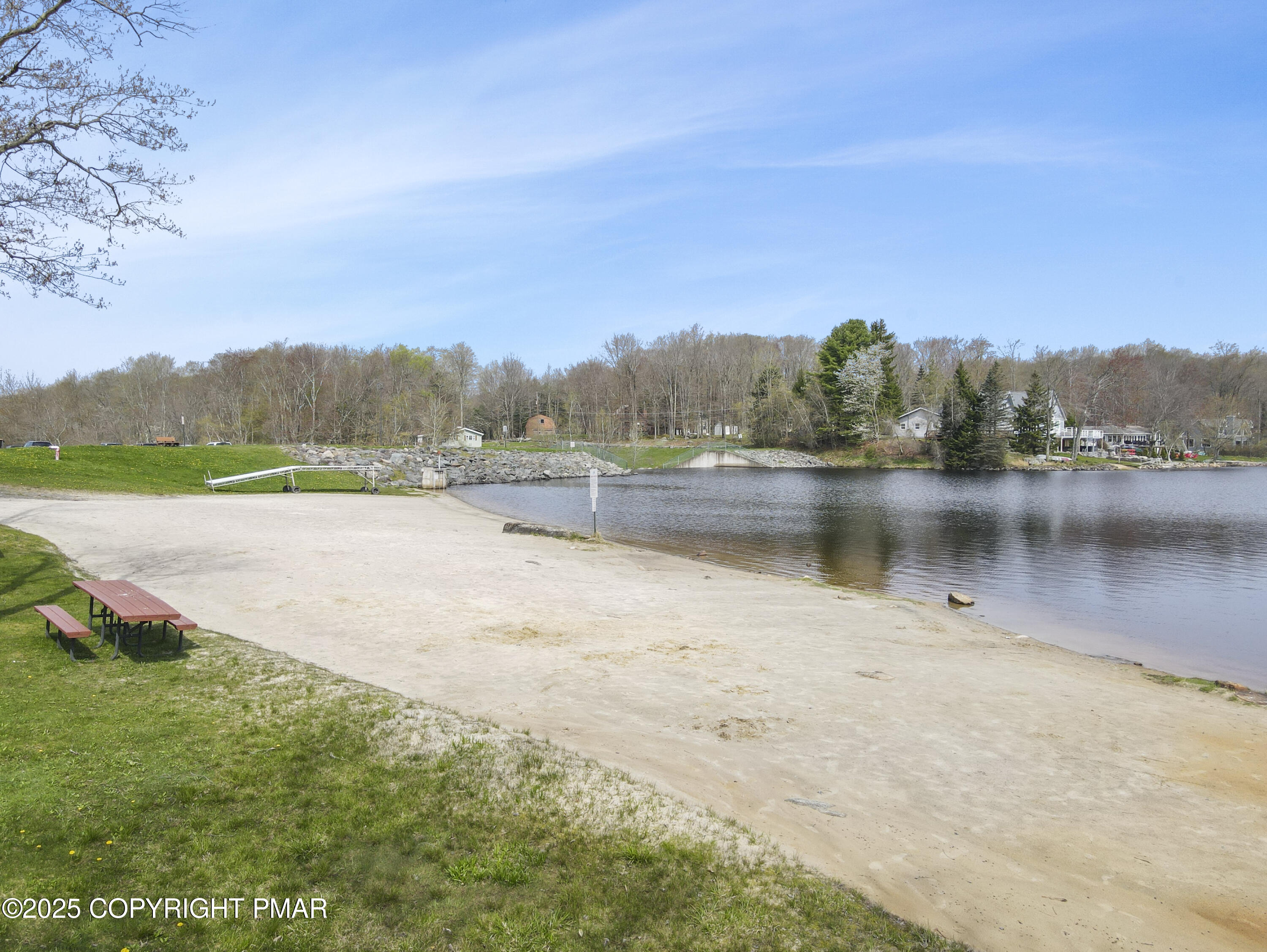 178 Comanche Trail Pocono Lake, PA 18347 - Photo 136 of 138 a view of a lake with a mountain in the background