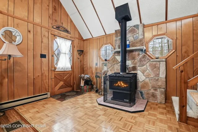 a livingroom with furniture wooden floor and a window