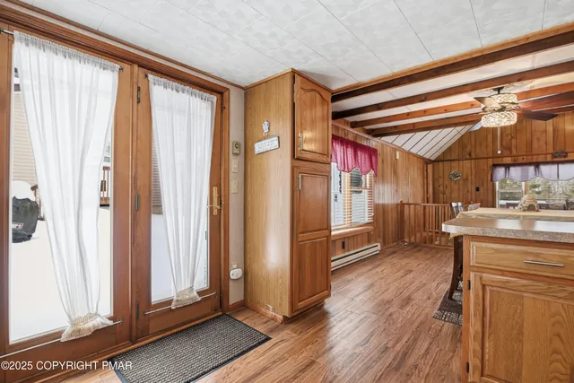 a bedroom with furniture and wooden floor