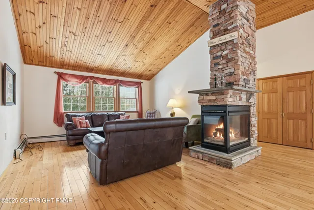a white toilet sitting next to a white wall
