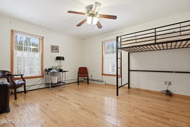 a bathroom with a sink a mirror a vanity and a shower