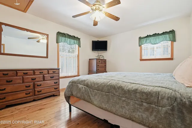 a living room with furniture and stairs