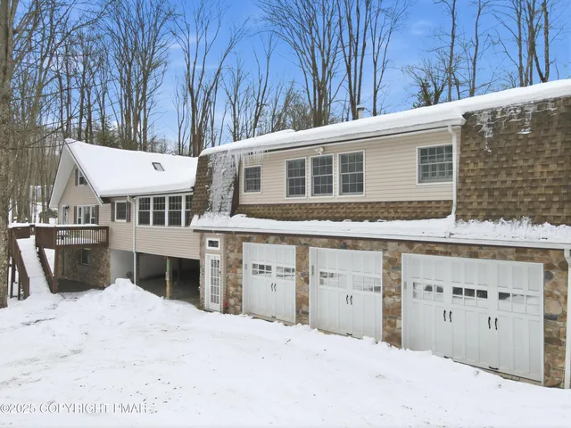 a front view of a house with glass windows