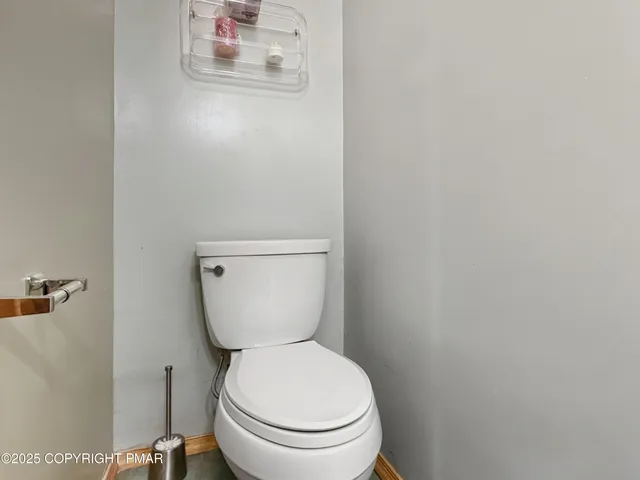 a view of a chair and tables in the balcony