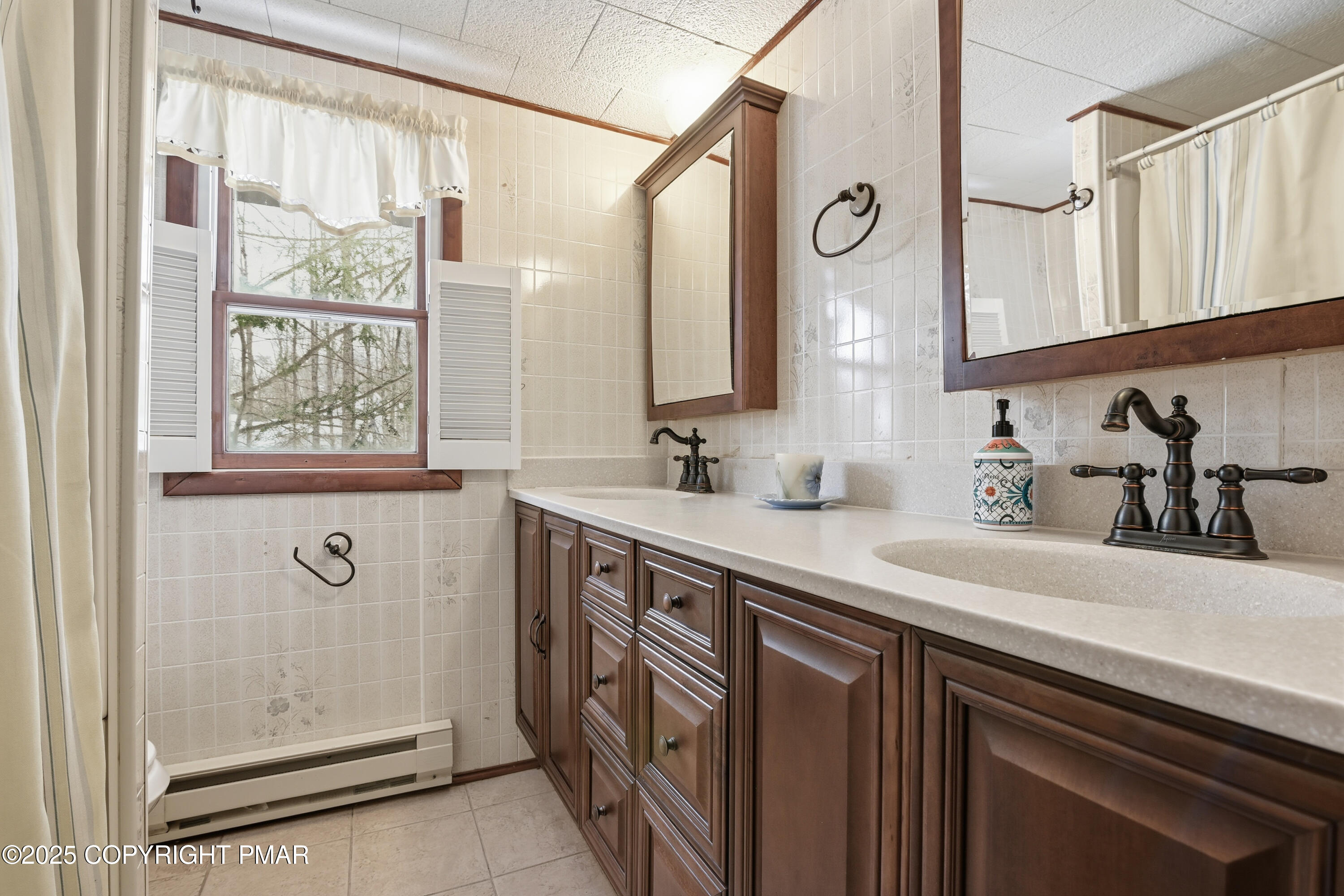 178 Comanche Trail Pocono Lake, PA 18347 - Photo 79 of 138 a bathroom with a sink a mirror a vanity and a shower