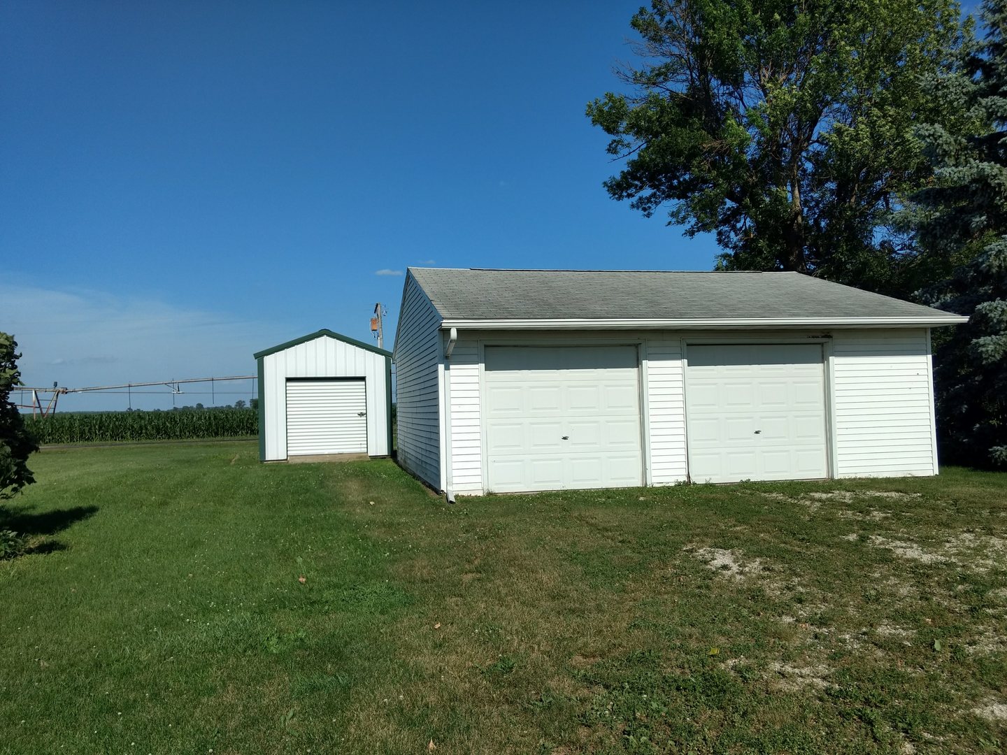 26980 Bell Road Tampico, IL 61283 - Photo 3 of 15 a house with green field in front of it