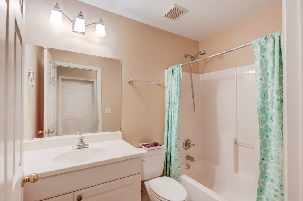 2405 Millwater Crossing Northeast Dacula, GA 30019 - Photo 22 of 63 a bathroom with a sink toilet and shower