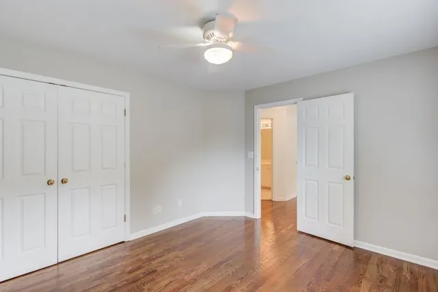 a view of a hallway with a window and stairs